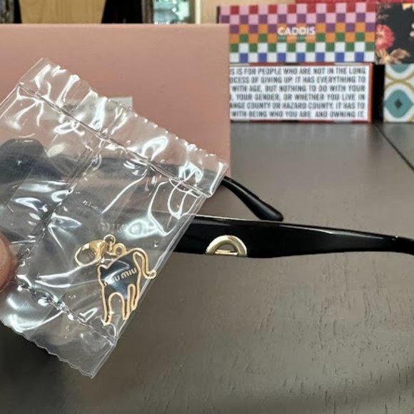 Miu Miu Charms sunglasses CHF565